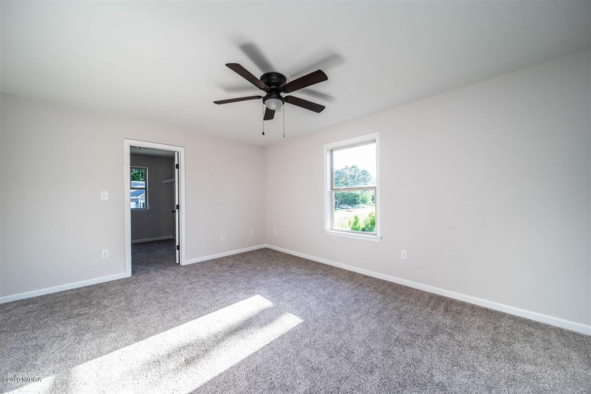 339 Walnut Grove Road Gray, GA 31032 - Photo 27 of 30 a view of a big room with windows and closet