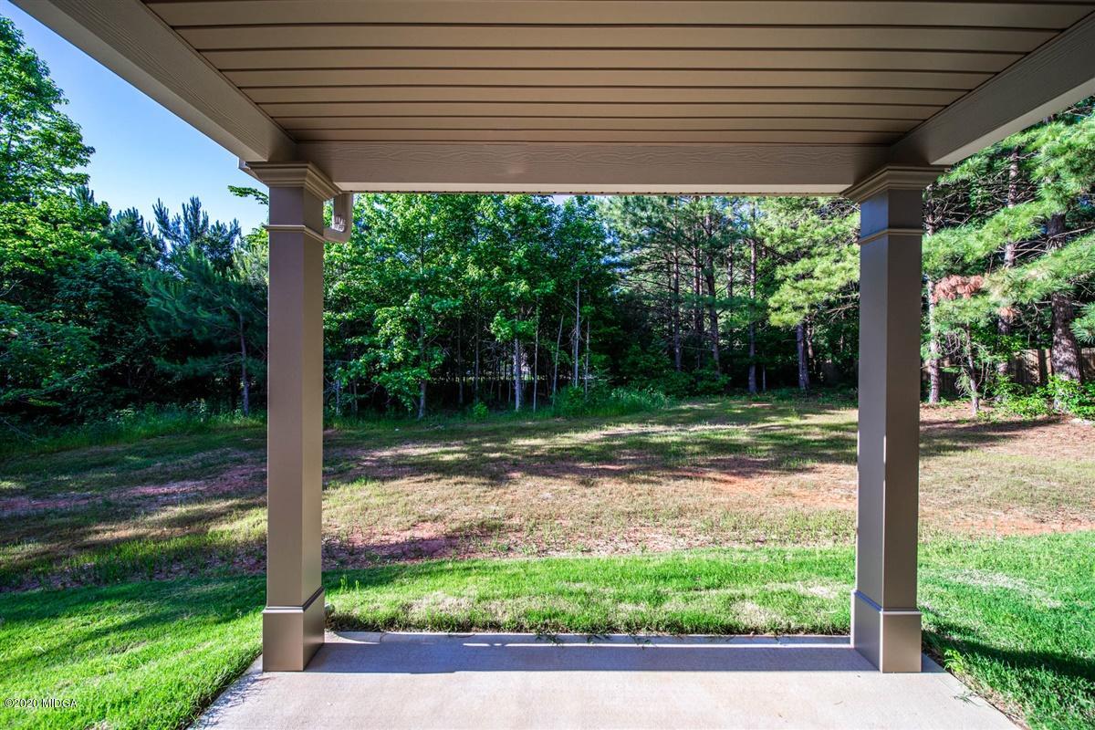 339 Walnut Grove Road Gray, GA 31032 - Photo 30 of 30 a view of a backyard with a large tree