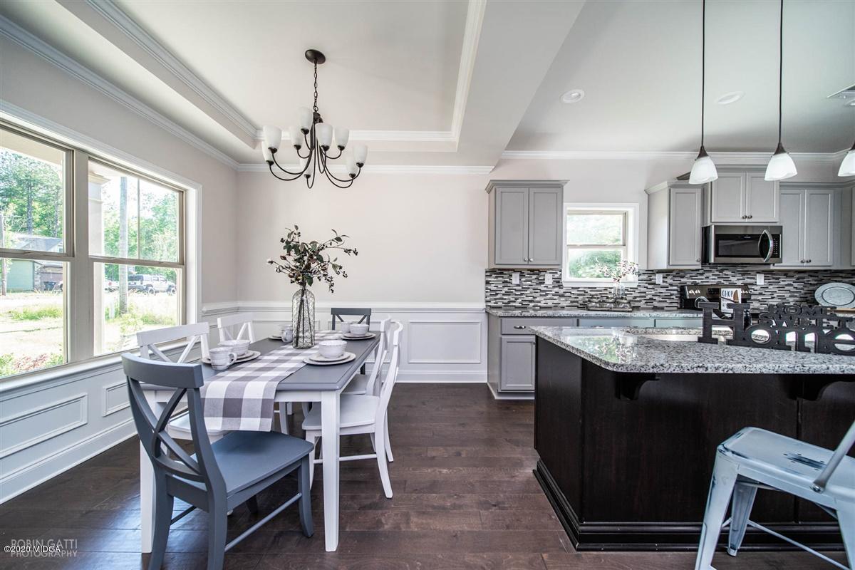 339 Walnut Grove Road Gray, GA 31032 - Photo 5 of 30 a view of a dining room with furniture window and wooden floor