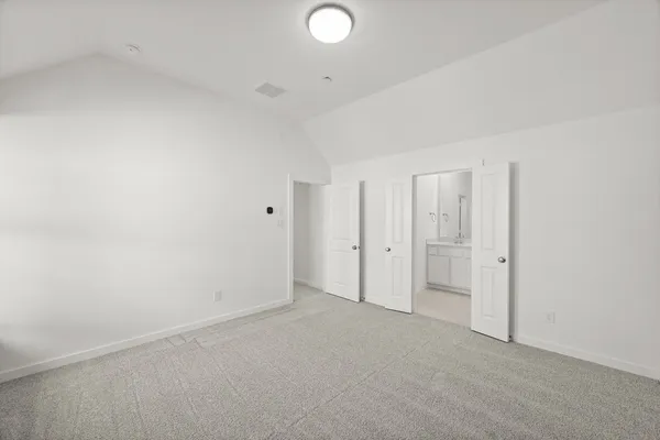 a bathroom with a double vanity sink mirror and bathtub