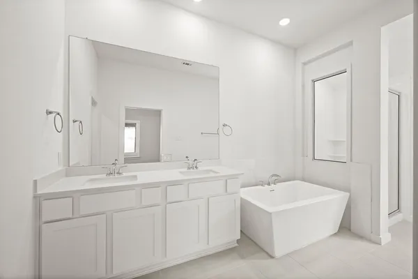 a spacious bathroom with a bathtub and mirror