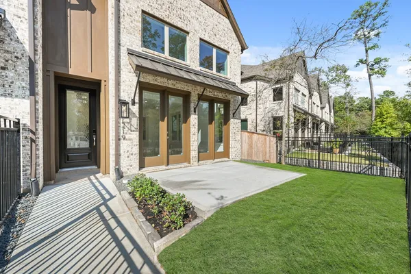 a view of a deck with a big yard