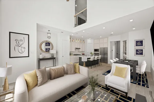 a living room with furniture kitchen view and a window