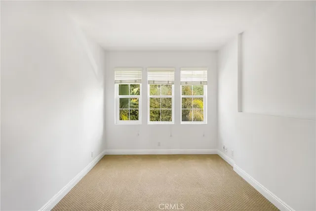 a kitchen with granite countertop a sink stove and refrigerator