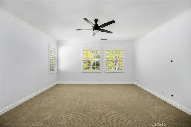a large kitchen with kitchen island granite countertop a sink a counter space and stainless steel appliances