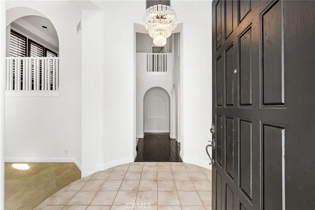 a view of an empty room with a window and fireplace