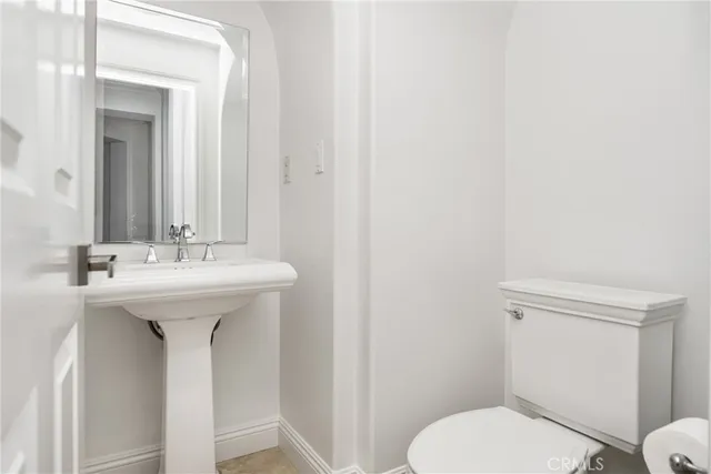 a kitchen with a stove a sink a refrigerator and dining table