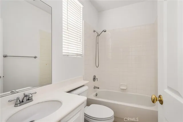 a kitchen with cabinets and stainless steel appliances