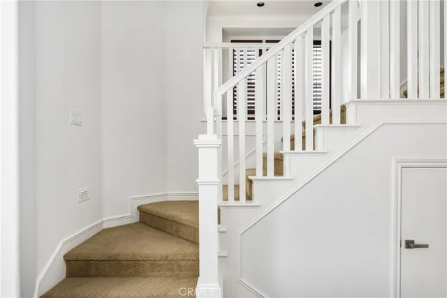 a view of a livingroom with furniture and a kitchen