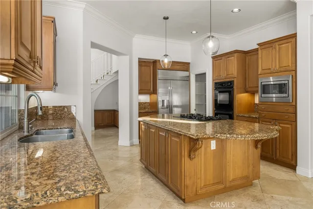 a view of a house with swimming pool and sitting area