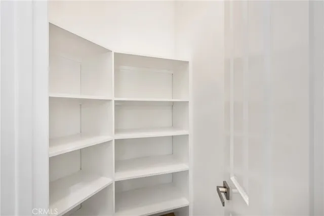 a view of a lake with houses in the background