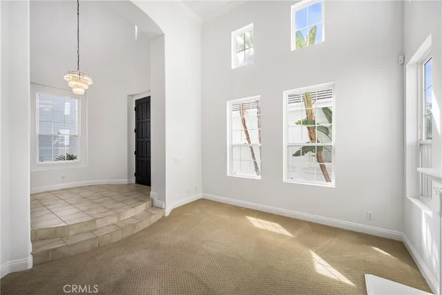 a view of a room with wooden floor and windows