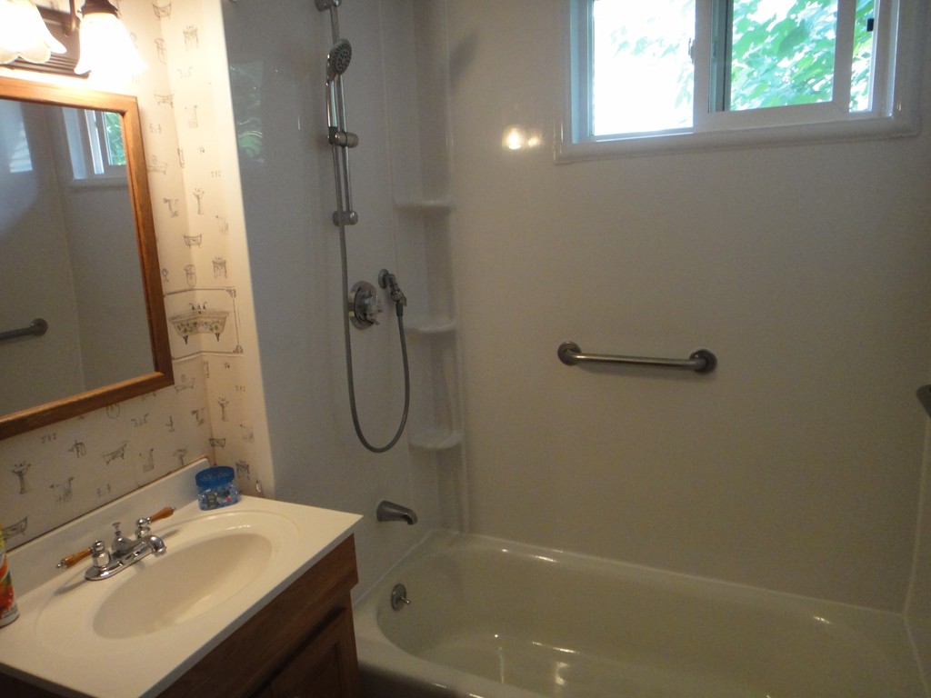 201 Marsden Street Springfield, MA 01109 - Photo 15 of 24 a bathroom with a sink a toilet and shower
