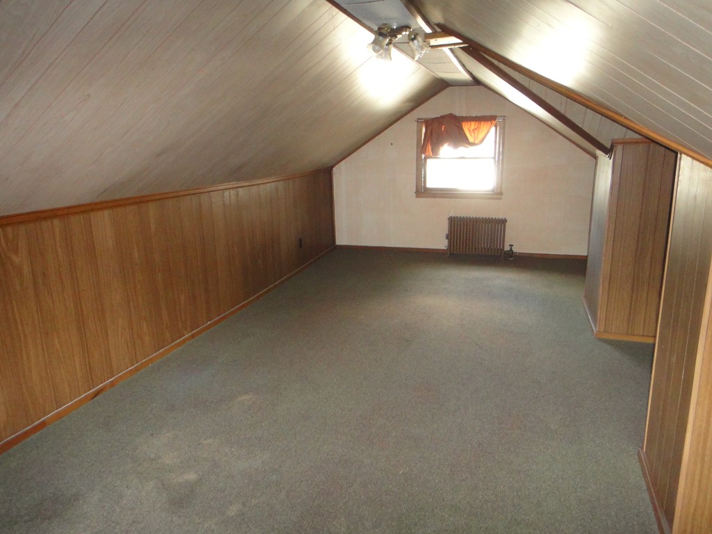 201 Marsden Street Springfield, MA 01109 - Photo 20 of 24 an empty room with windows and mirror