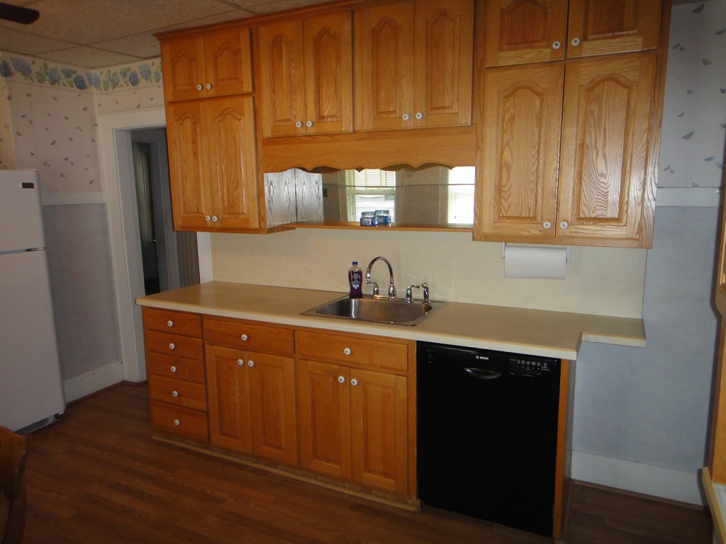 201 Marsden Street Springfield, MA 01109 - Photo 3 of 24 a kitchen with stainless steel appliances granite countertop wooden cabinets a sink and dishwasher