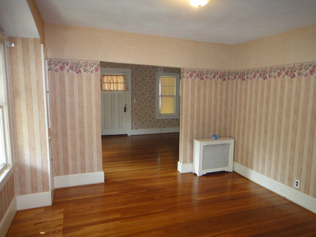 201 Marsden Street Springfield, MA 01109 - Photo 4 of 24 a view of a livingroom with wooden floor