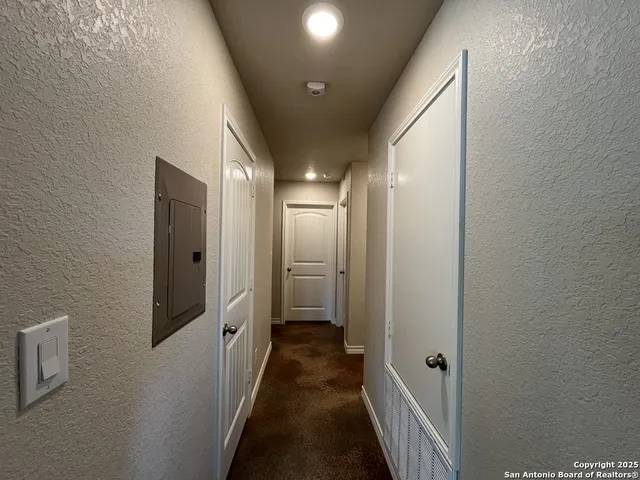 a bedroom with a bed and cabinets