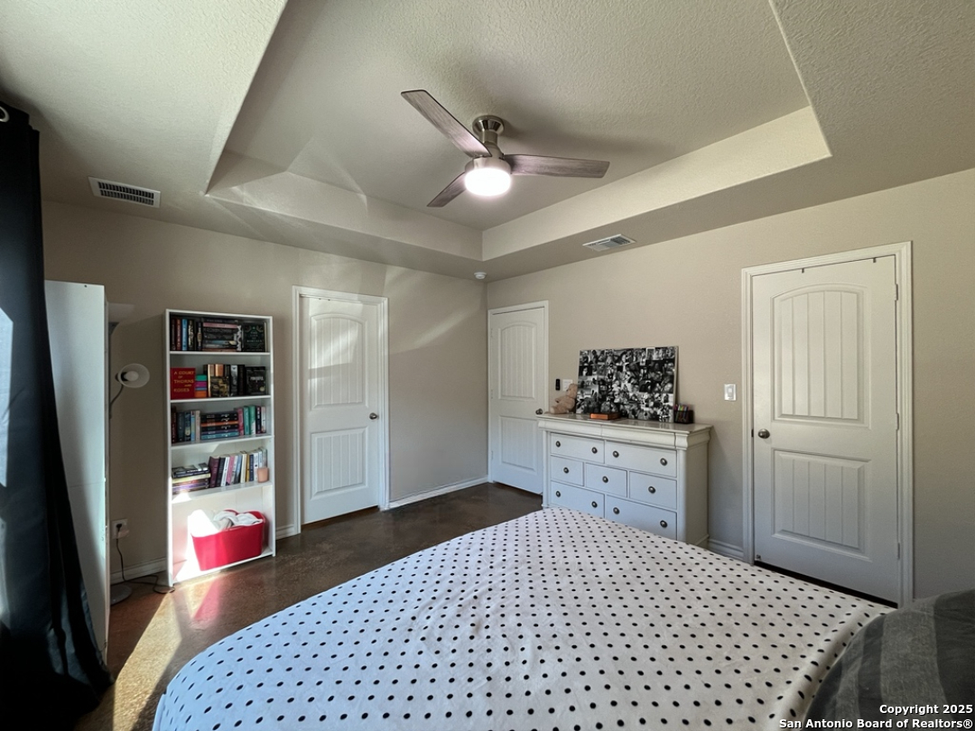 2708 Golf Drive Spring Branch, TX 78070 - Photo 13 of 31 a bedroom with a bed and cabinets