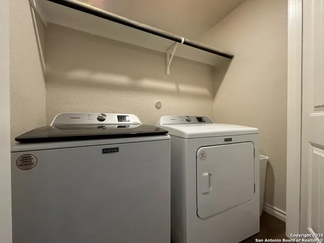 a view of balcony with wooden floor and fence