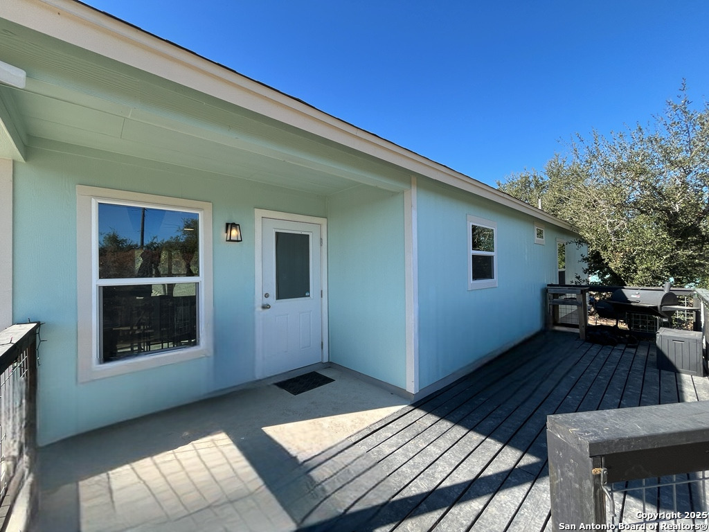 2708 Golf Drive Spring Branch, TX 78070 - Photo 23 of 31 a backyard of a house with wooden floor and outdoor space