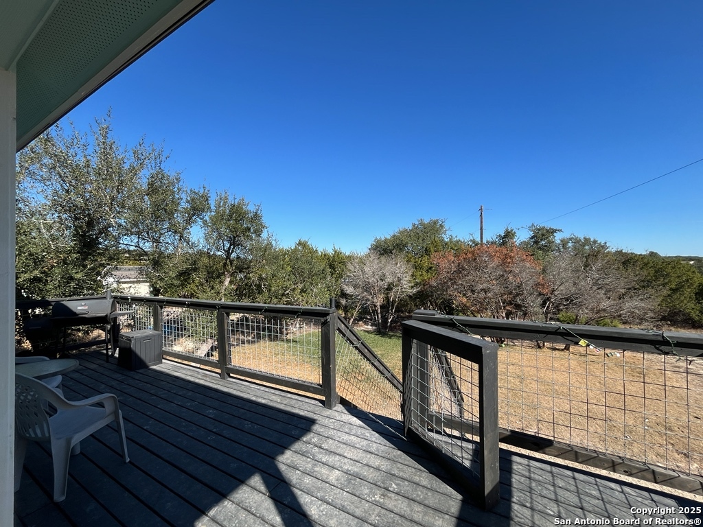 2708 Golf Drive Spring Branch, TX 78070 - Photo 24 of 31 a view of balcony with wooden floor and fence