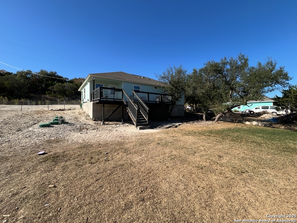 2708 Golf Drive Spring Branch, TX 78070 - Photo 26 of 31 a view of a house with a yard