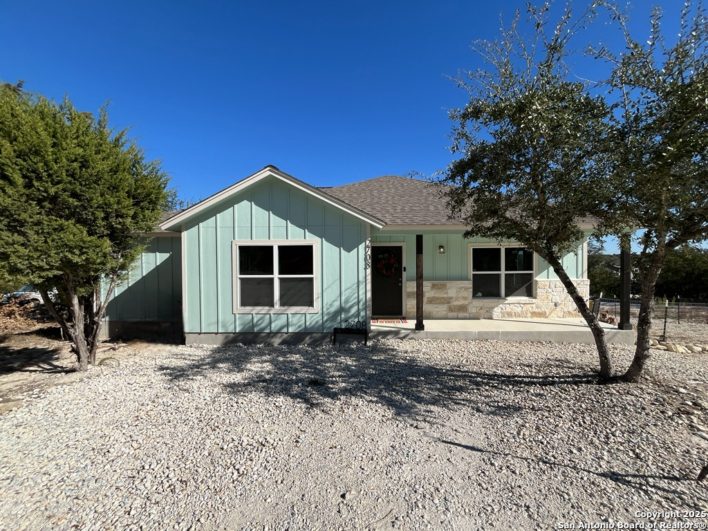 2708 Golf Drive Spring Branch, TX 78070 - Photo 30 of 31 a front view of a house with a yard