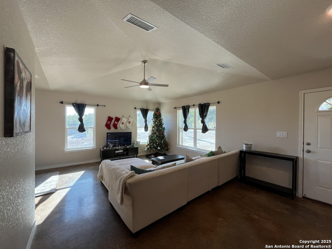 2708 Golf Drive Spring Branch, TX 78070 - Photo 3 of 31 a living room with furniture and a wooden floor