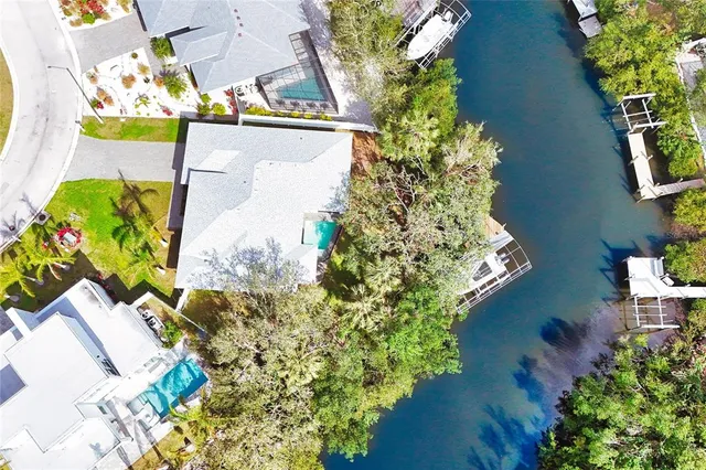 an aerial view of a house with swimming pool