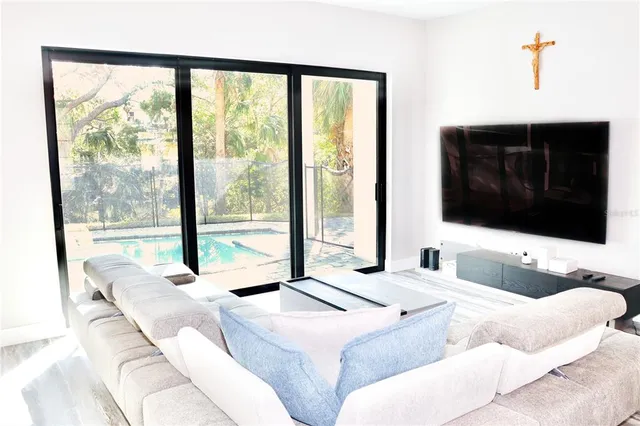 a bathroom with a granite countertop sink a mirror and shower