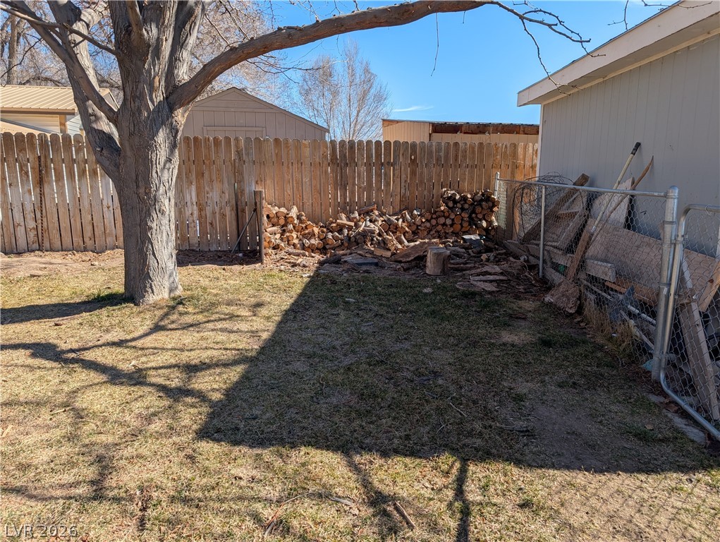 320 6th Street Panaca, NV 89042 - Photo 25 of 31 View of fenced backyard with firewood area