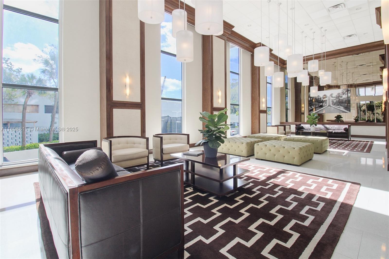 5 Island Avenue, Unit 4E Miami Beach, FL 33139 - Photo 15 of 23 a living room with furniture and a floor to ceiling window