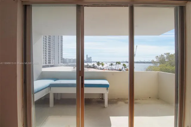 a room with a bench and a table chair