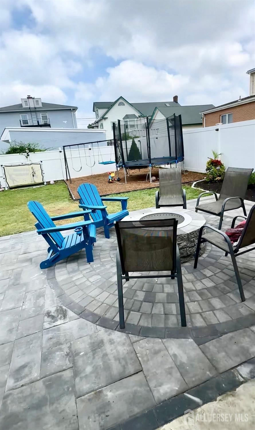 985 Arnet Avenue Union, NJ 07083 - Photo 11 of 12 a living room with furniture a flat screen tv and lawn chairs