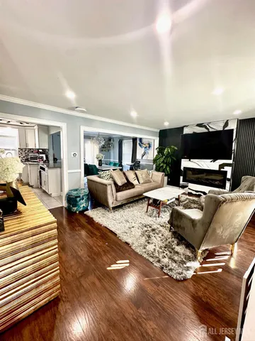 a bedroom with furniture and a wooden floor
