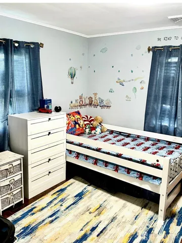 a view of room with furniture and flat screen tv