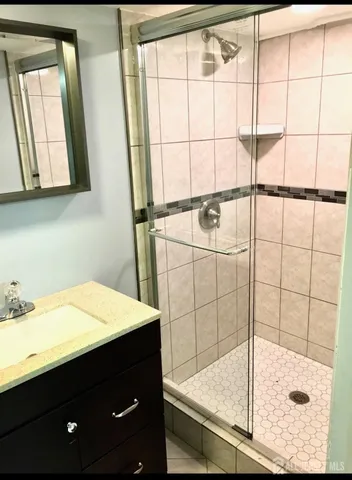 a bathroom with a sink and a shower