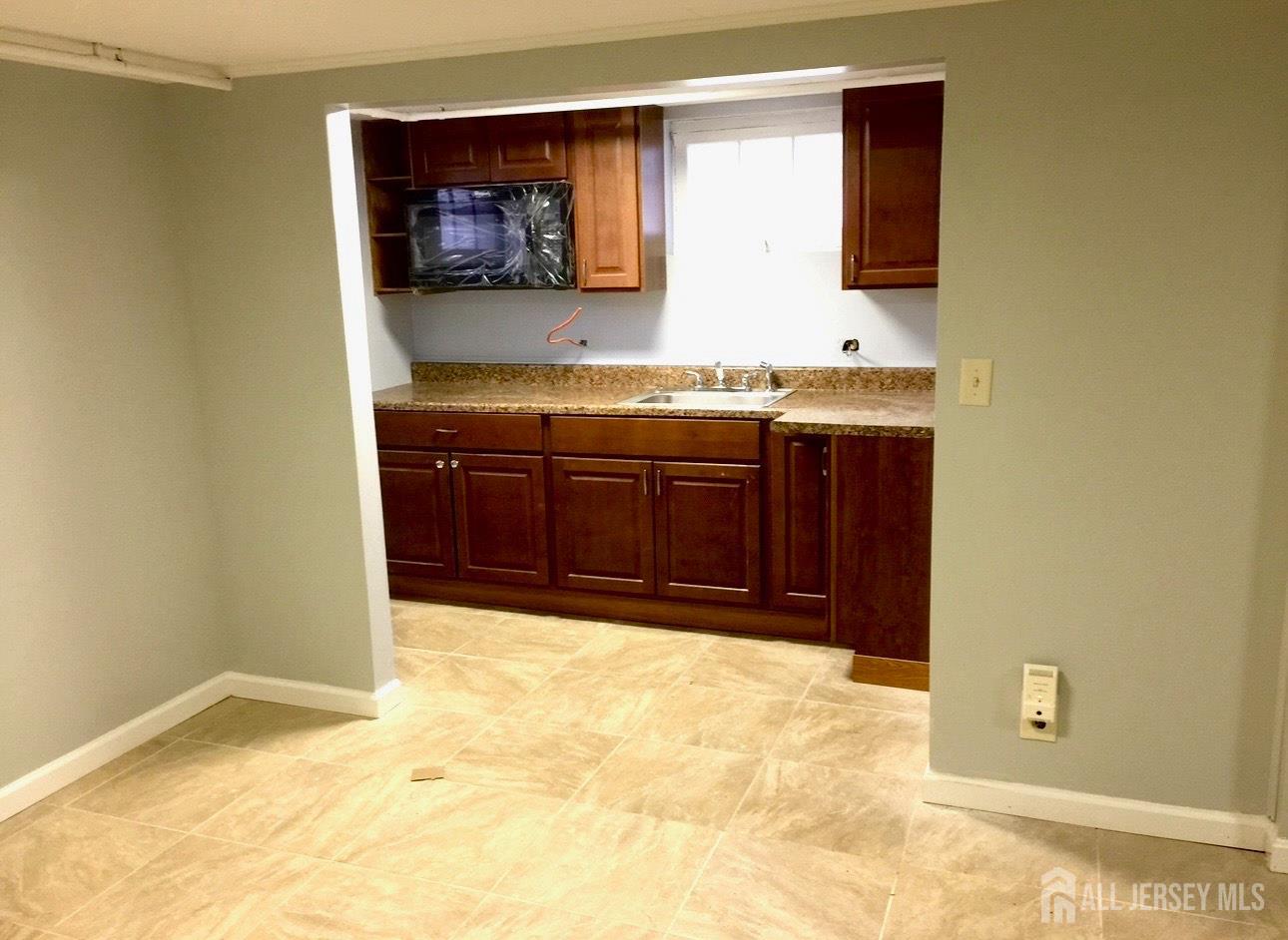 985 Arnet Avenue Union, NJ 07083 - Photo 7 of 12 a bathroom with a sink and a mirror