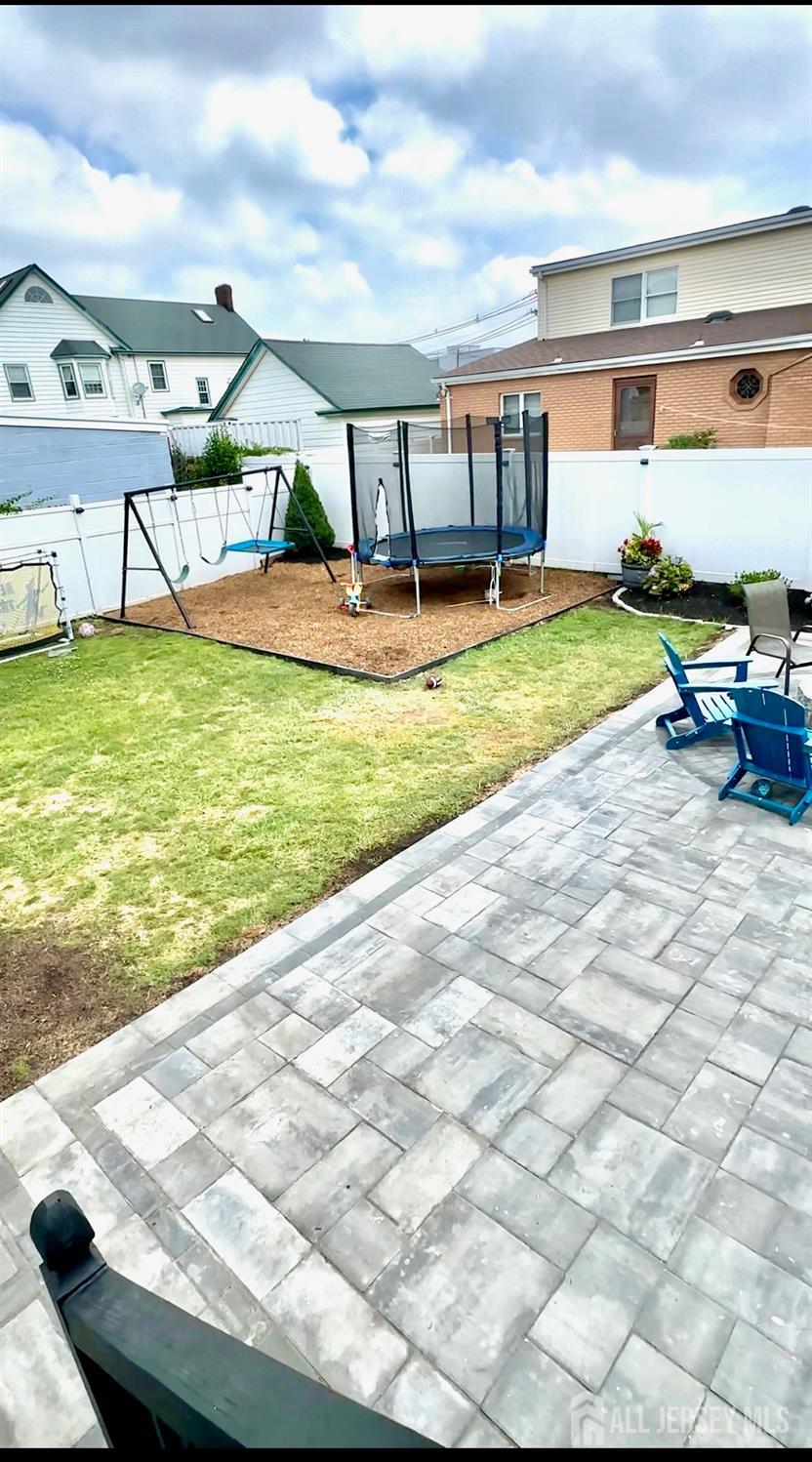 985 Arnet Avenue Union, NJ 07083 - Photo 10 of 12 a view of a house with a backyard porch and sitting area