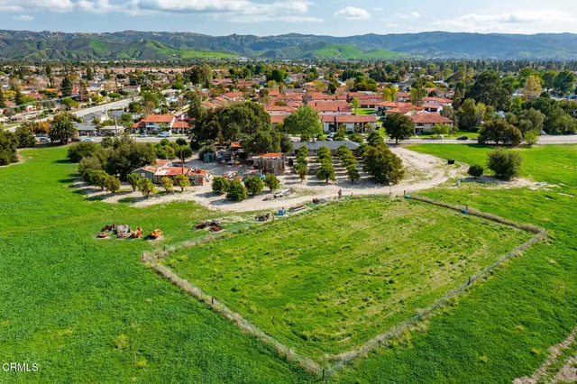 a view of a town with mountains in the background