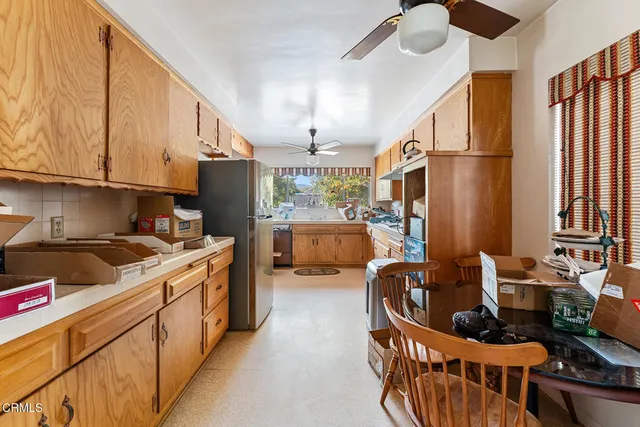 a kitchen with stainless steel appliances granite countertop a stove a sink dishwasher and a refrigerator