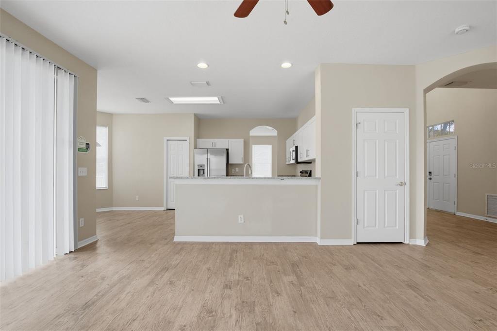 27001 Arrowbrook Way Wesley Chapel, FL 33544 - Photo 11 of 44 wooden floor with white cabinets and wooden floor