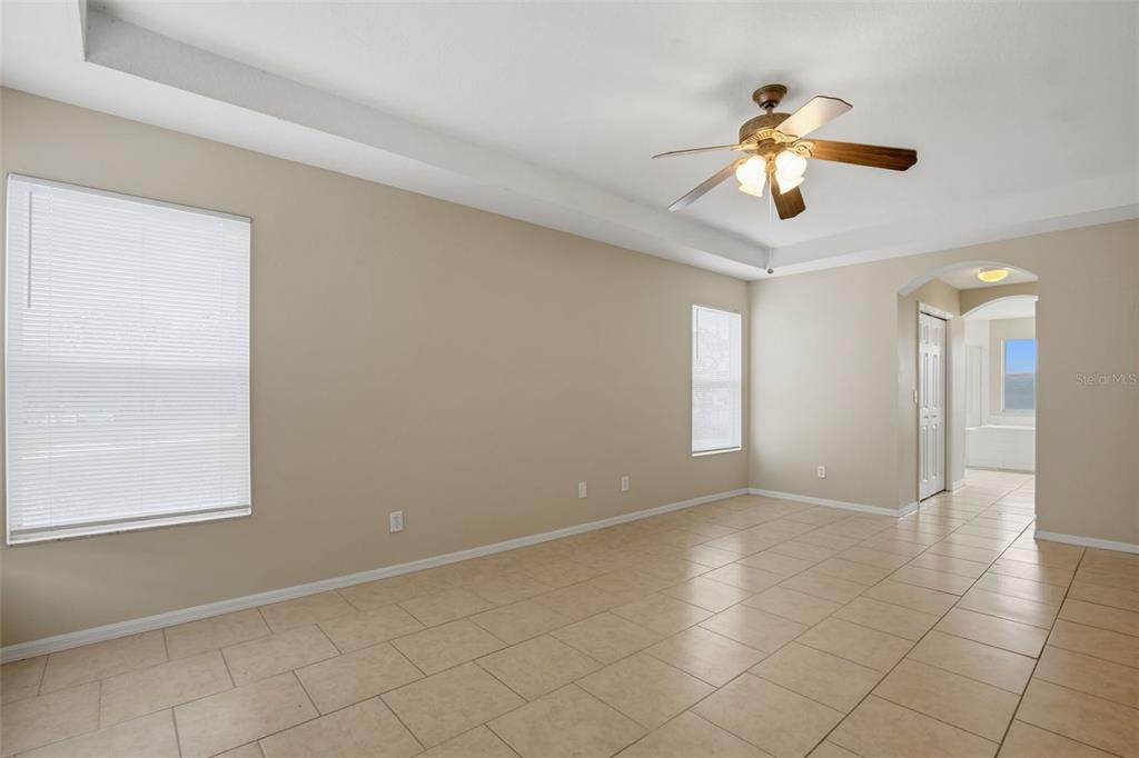 27001 Arrowbrook Way Wesley Chapel, FL 33544 - Photo 12 of 44 an empty room with windows and fan
