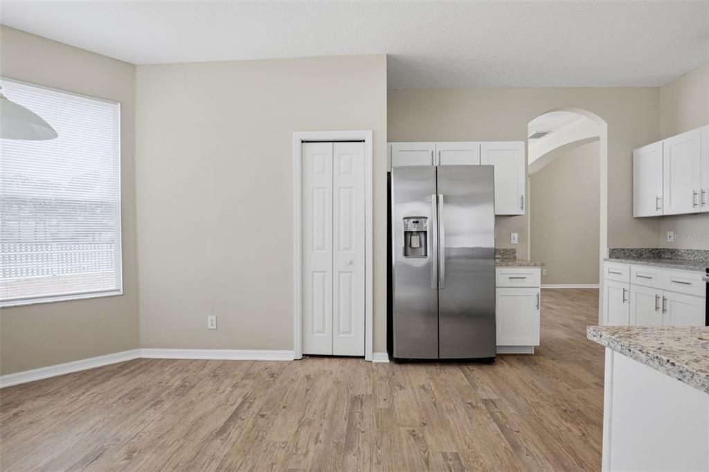 27001 Arrowbrook Way Wesley Chapel, FL 33544 - Photo 14 of 44 a kitchen with stainless steel appliances granite countertop a refrigerator and a stove