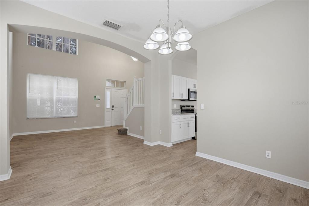 27001 Arrowbrook Way Wesley Chapel, FL 33544 - Photo 19 of 44 a view of empty room with wooden floor