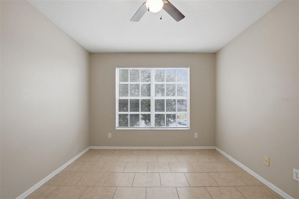 27001 Arrowbrook Way Wesley Chapel, FL 33544 - Photo 29 of 44 an empty room with a window and a ceiling fan
