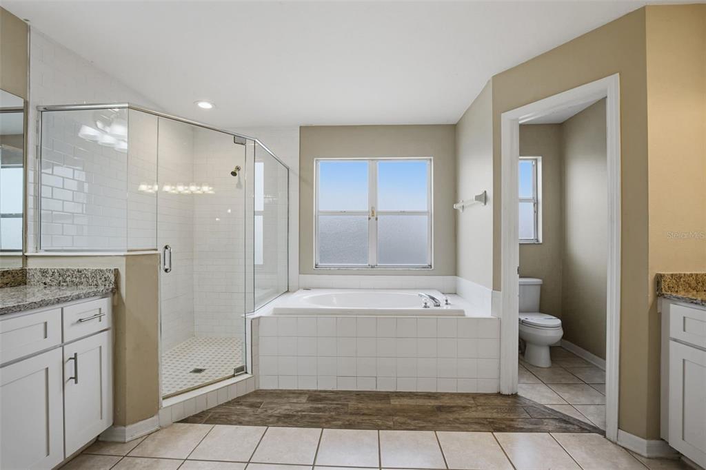 27001 Arrowbrook Way Wesley Chapel, FL 33544 - Photo 37 of 44 a bathroom with a tub shower and sink