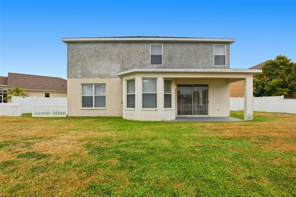 27001 Arrowbrook Way Wesley Chapel, FL 33544 - Photo 42 of 44 a front view of a house with a garden