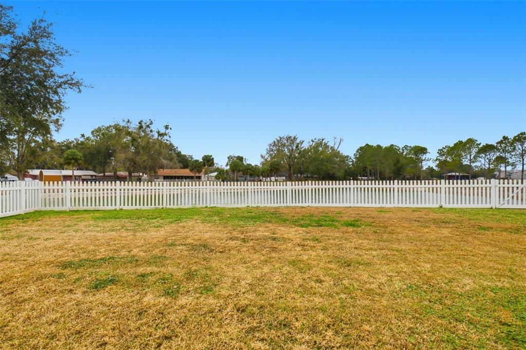 27001 Arrowbrook Way Wesley Chapel, FL 33544 - Photo 43 of 44 a view of a swimming pool with an outdoor space and seating area