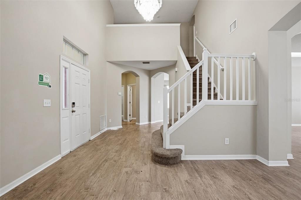 27001 Arrowbrook Way Wesley Chapel, FL 33544 - Photo 5 of 44 a view of entryway and hall with wooden floor